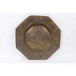 17th century style Dutch embossed brass charger, octagonal form with figural reserve and scrolling t