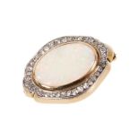 Opal and diamond brooch with an oval opal cabochon measuring approximately 17.4 x 12mm surrounded by