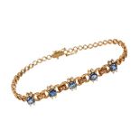 Sapphire and diamond bracelet with five oval mixed cut blue sapphires and brilliant cut diamonds in