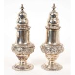 Pair of 1920s silver George style pepperettes with gadrooned borders, Hallmarked London 1928