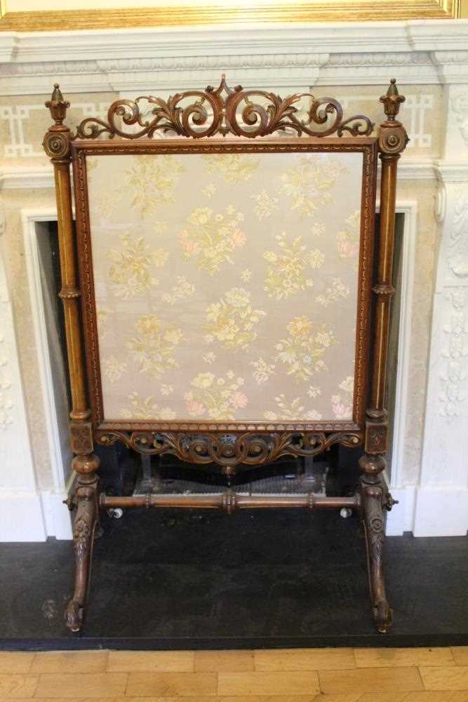 Good quality Victorian carved walnut and parcel gilt framed fire screen with pierced scroll cresting