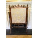 Good quality Victorian carved walnut and parcel gilt framed fire screen with pierced scroll cresting