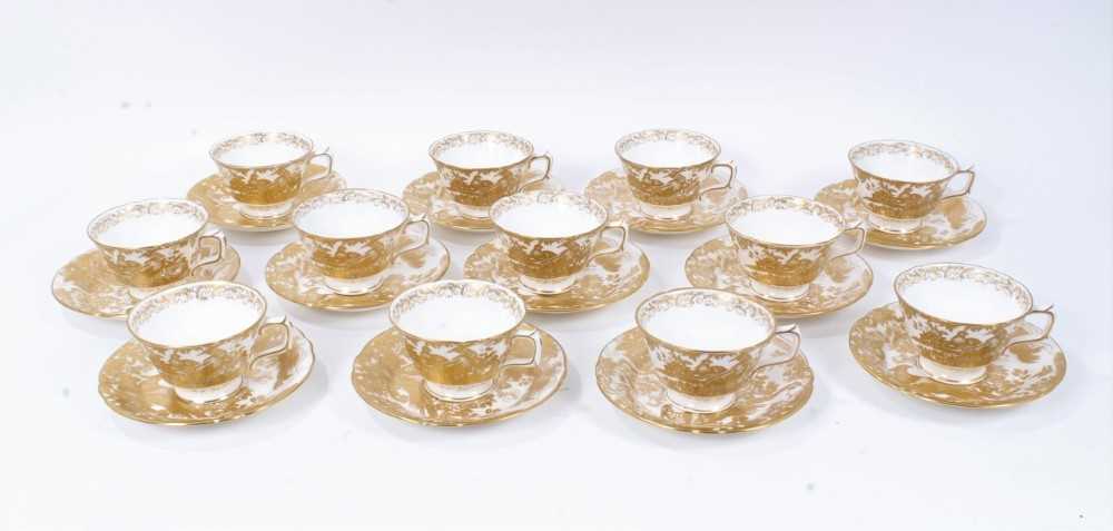 Set of twelve Royal Crown Derby Gold Aves tea cups and saucers