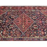 Persian rug with central lozenge medallion