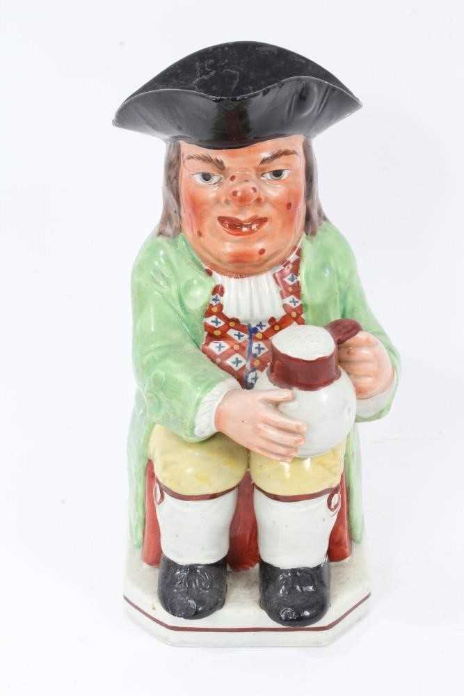 Early 19th century Staffordshire Pearlware Toby jug, in green jacket and brightly coloured waistcoat