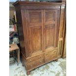 George III mahogany wardrobe enclosed by two panelled doors and four drawers below on bracket feet,