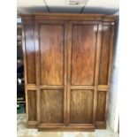 Good quality Edwardian inlaid mahogany breakfront wardrobe by Maple & Co. enclosed by two panelled d