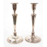 Pair of early George V baluster candlesticks, one damaged