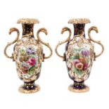 Pair Early 19th century English porcelain two handled vases, painted with flowers, on a blue ground,