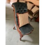 Victorian button upholstered scroll back rosewood chair, raised on cabriole legs and castors