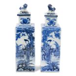 Pair of 19th century Chinese Kangxi style blue and white porcelain vases and covers