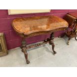 Victorian burr walnut veneered card table with shaped fold-over top on carved and turned supports wi