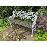 White painted cast iron bench, with lattice, vine and bird ornament