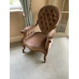 Victorian button back armchair, with teardrop shaped back raised on carved walnut showood frame with