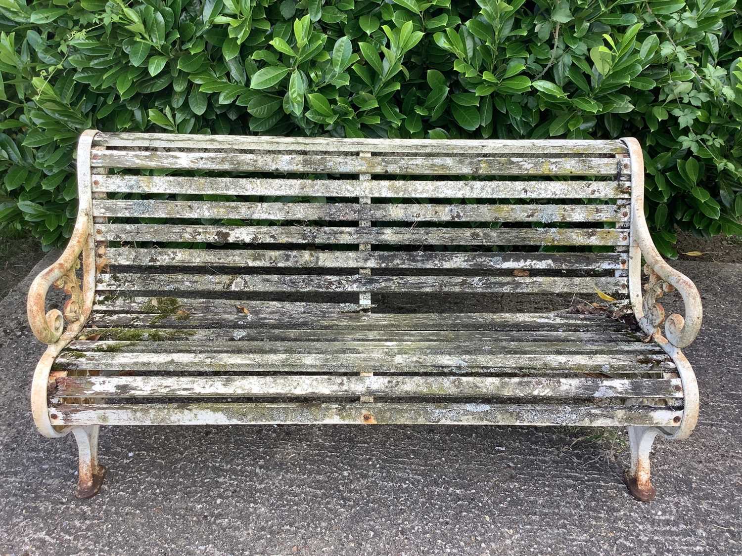 Victorian style cast iron garden bench with wooden slats