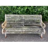 Victorian style cast iron garden bench with wooden slats