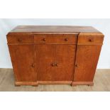 Suite of 1930s oak furniture in the manner of Heals, including refectory style table and sideboard