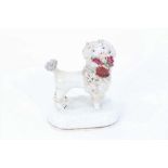 Staffordshire porcelain model of a poodle carrying a basket, circa 1840