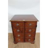 Antique-style burr walnut finished cupboard with oval brass handles