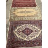 Bokhara carpet 180cm x 128cm, Kashmir carpet 190cm 125cm and a Kashmir carpet 180cm x 130cm (3)