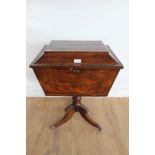 Victorian mahogany teapoy of sarcophagus form, on turned support and splayed tripod base