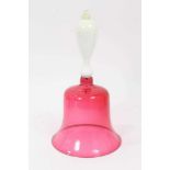 A Victorian cranberry tinted glass bell