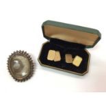 Pair of 9ct gold cuff links and oval glazed locket brooch containing hair