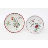 Two Liverpool saucers, decorated in Chinese famille rose style