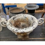 Antique iron cauldron, together with two cast iron garden urns