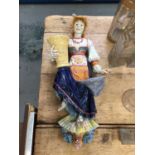 Continental majolica figural wall pocket, in the form of a young girl in traditional dress