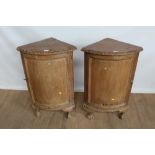 Pair of continental stripped pine corner bowfront cupboards