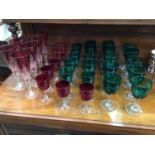 Collection of Victorian green and cranberry coloured wine glasses, together with six Bohemian cut gl