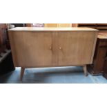 Mid 20th century Morris of Glasgow Cumbrae sideboard with two doors enclosing single drawer and shel