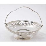 1920s silver swing handled dish, with pierced decoration, on a compressed pedestal foot