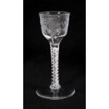Georgian double series opaque twist wine glass, circa 1765, the ogee bowl etched with flowers, on a