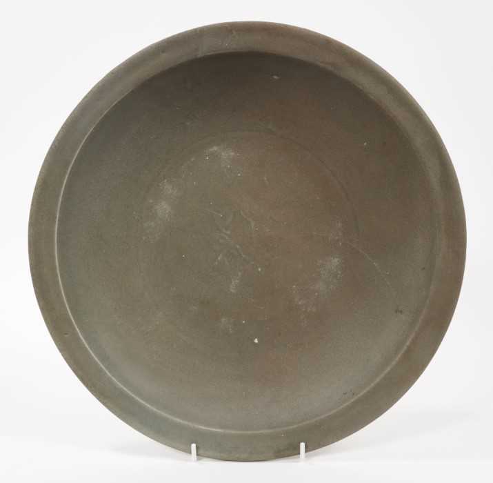 Chinese celadon dish, Yuan dynasty, from the Java shipwreck, with floral moulding, 31cm diameter, to