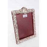 Late Victorian silver mounted photograph frame of rectangular form with relief floral, foliate and s