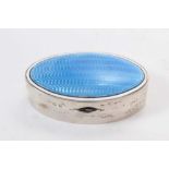 George V silver pill box of oval form with blue guilloché enamel decoration to hinged cover (Birming