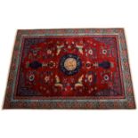 Fine quality antique Chinese Khotan carpet, with auspicious symbols on scarlet ground, within geomet