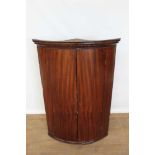 George III mahogany bow fronted, double door corner cupboard