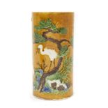 A Chinese sleeve vase, 20th century, decorated in the Sancai style with two cranes, seal mark to bas