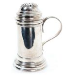 1930s silver kitchen pepper of cylindrical form in the Georgian style, with side mounted handle
