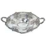 Victorian silver cake basket of circular form with chased and engraved foliate/scroll decoration