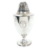 Large 1930s silver caster of urn form, with applied armorial cartouche and pierced domed cover,