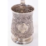 George III silver tankard of baluster form with scroll handle and later chased floral and scroll dec