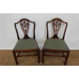 Pair of George III shield back chairs standing on tapered legs