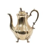 Victorian silver gilt coffee pot of baluster form with engraved foliate and scroll decoration