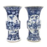Pair of 19th century Chinese blue and white Gu vases, one significantly damaged