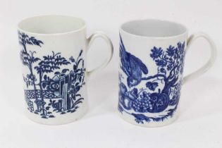Two Worcester blue and white tankards, circa 1780, one printed with the Parrot Pecking Fruit pattern