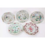 Five 18th century Chinese famille rose dishes, one of lotus form, the others decorated with landscap